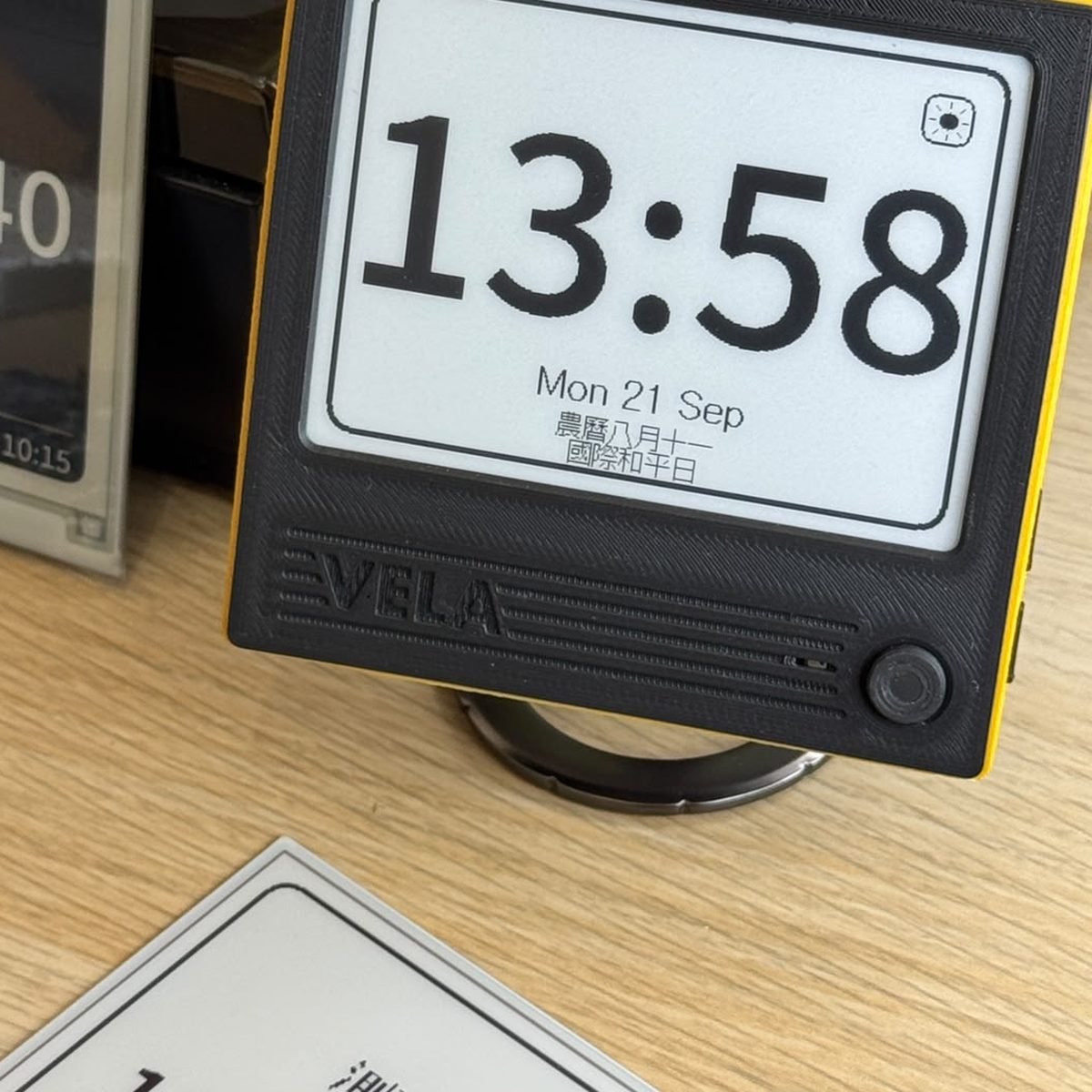 A VELA 42BW on a desk, showing Clock