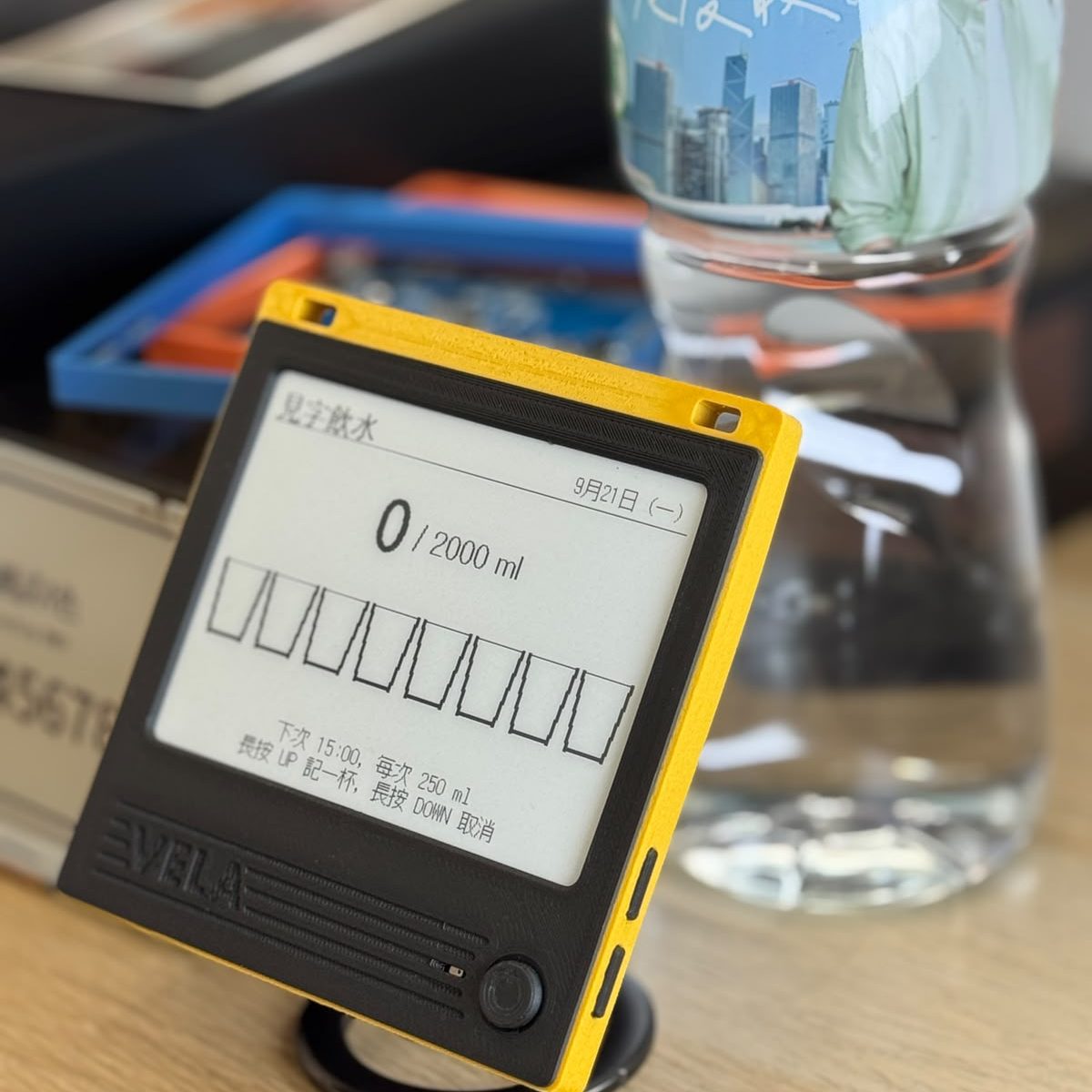 A VELA 42BW on a desk, showing Drink water