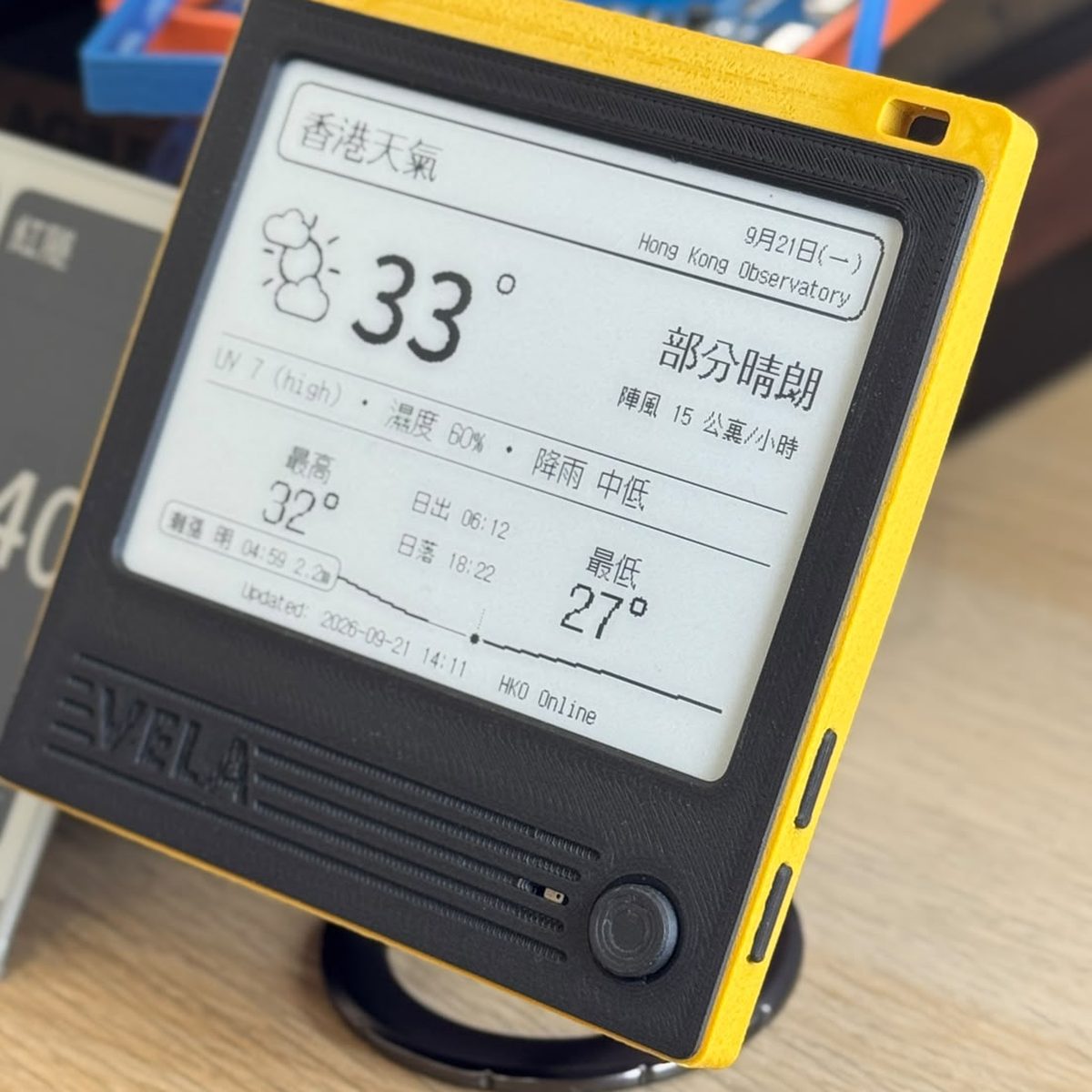 A VELA 42BW on a desk, showing Weather